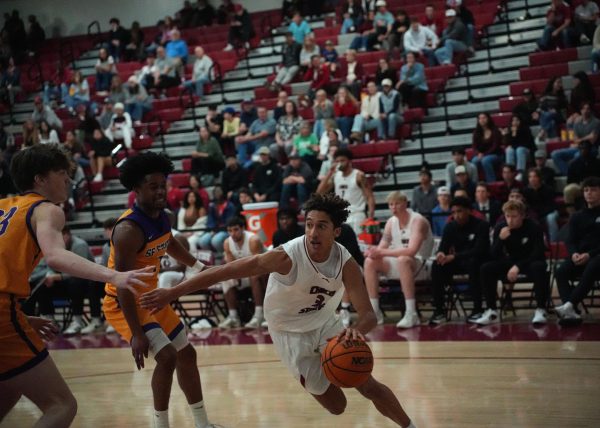 Junior guard Miles Daniels blocks opposing players from San Francisco State while trying to advance the offense Saturday, Dec. 7, 2024, at Chico State. 