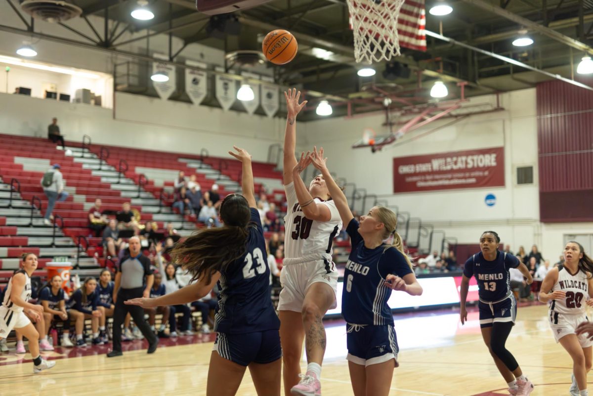 Senior forward Meadow Aragon attempts a contested lay-up in a game against Menlo College on Nov. 14. Photo taken by Aaron Draper.
