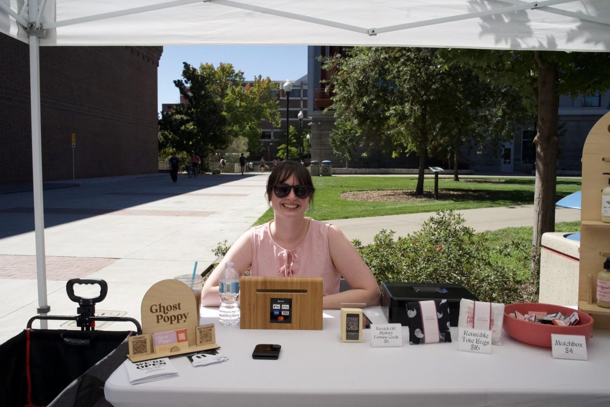 Karle Schultze-Dyer, owner of Ghost Poppy, welcomes onlookers with a sunny smile. Photo taken on Sept. 22. 