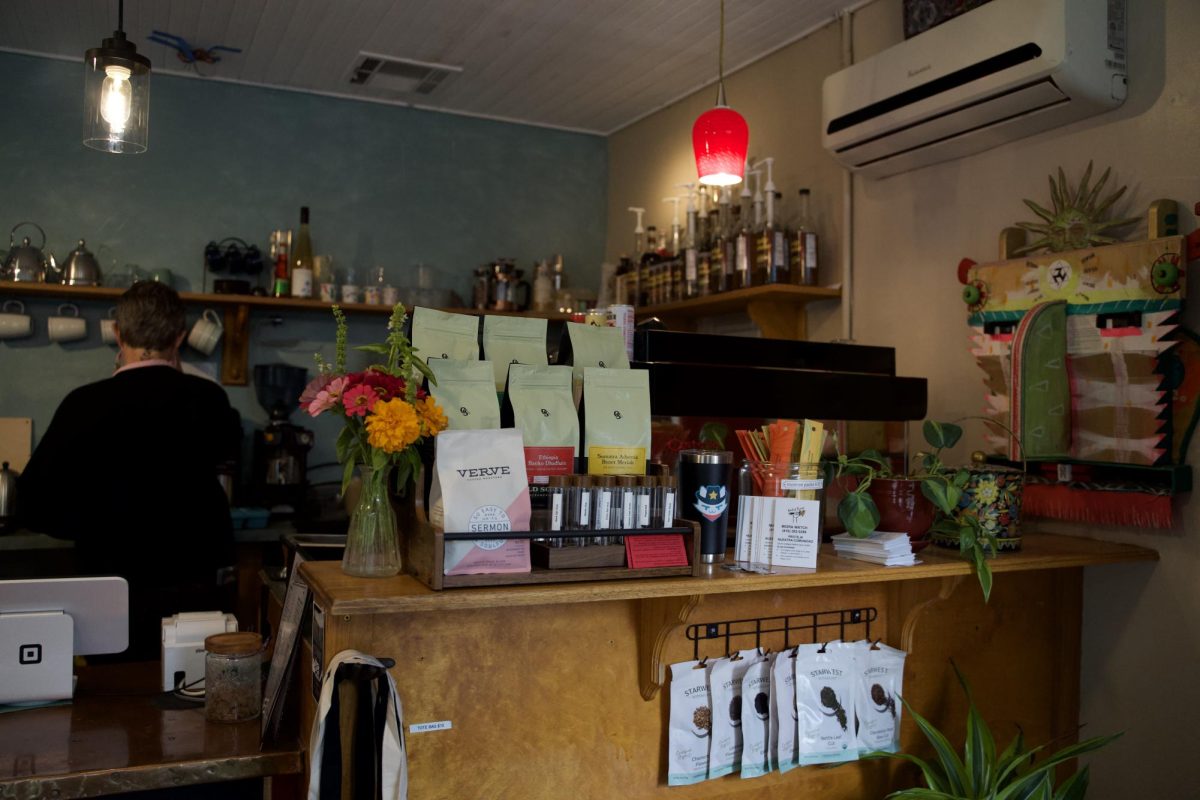 The inside of the cafe is eclectic and vibrant, as seen through Andrew's choice to incorporate different styles of lighting and colored walls. Photo taken by Lexi Lynn on Oct. 28, 2025.