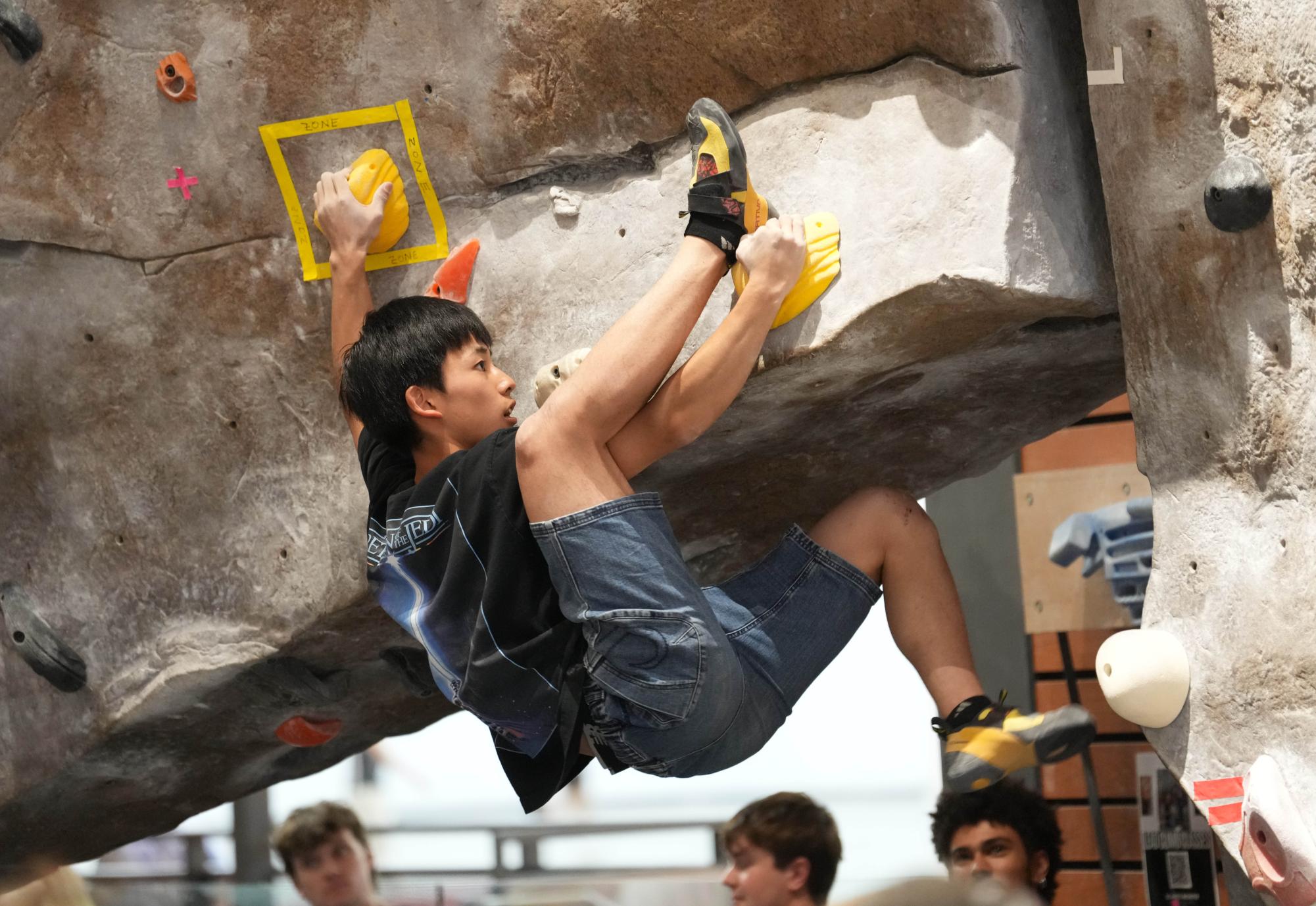 Koichi Kurita on the hardest route in the competition. He made it further than the rest of the climbers, but still didn't complete the whole route. Photo taken by Aiyana Curry on Nov. 11, 2025.