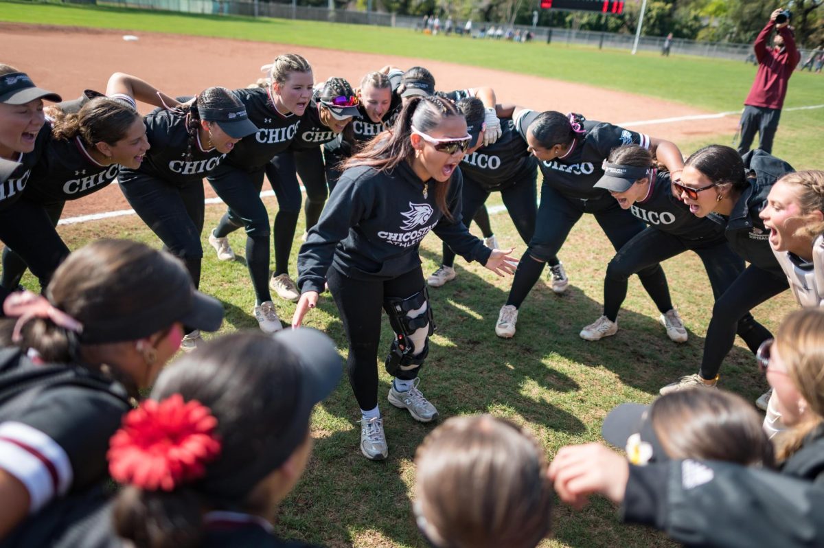 Mia Santos, a returning senior outfielder, encourages her teammates before a game last season. Photo taken by Jason Halley on Mar. 29, 2025