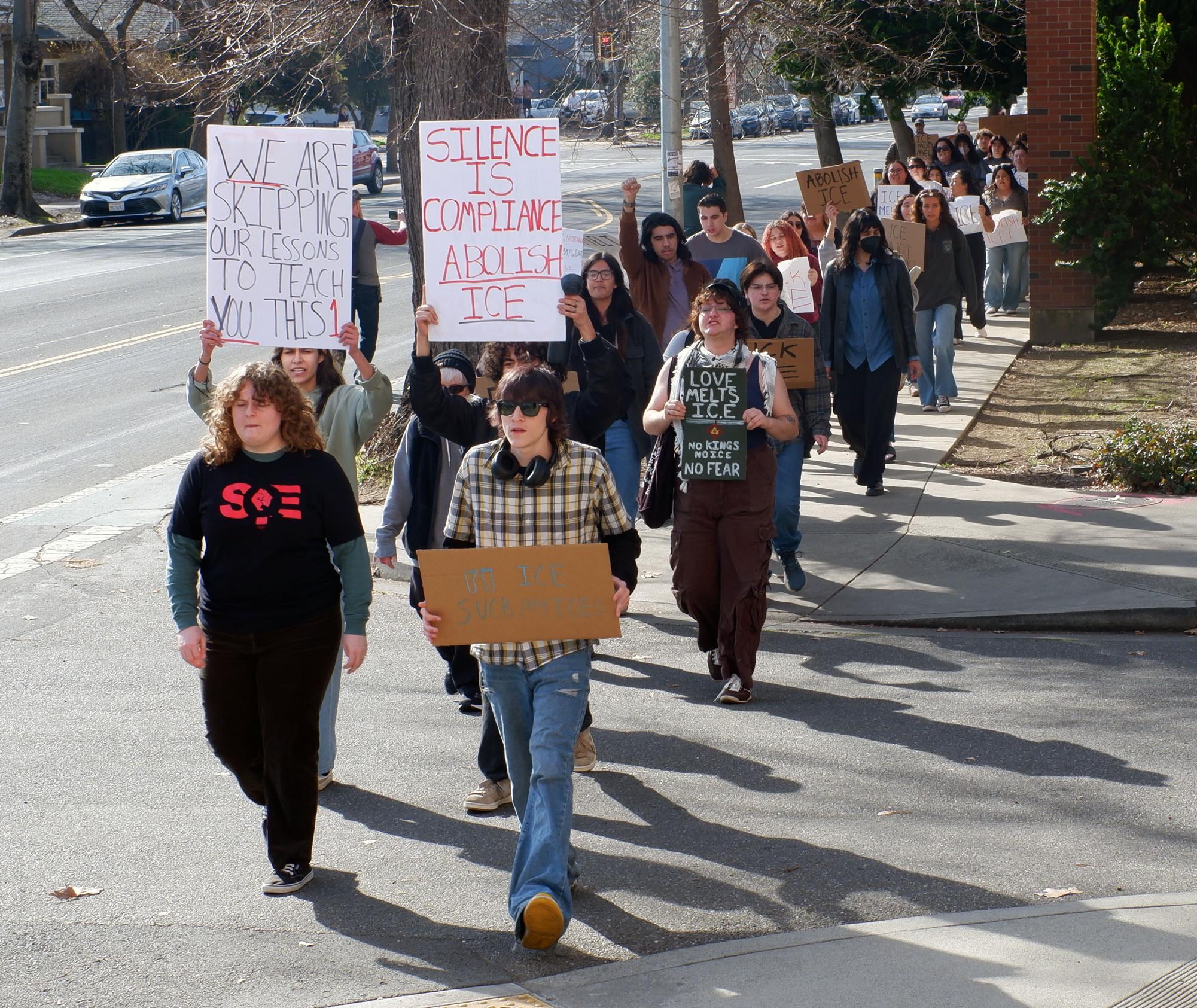 The protest started at noon and slowly gathered more members as they marched around campus chanting and waving at honking cars. Photo taken by Sean Shanks on Jan. 30, 2026.