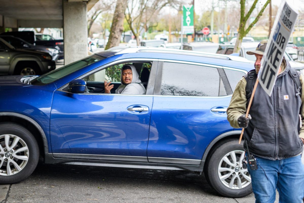 Members of the striking Teamsters Local 2010 union picket in front of the Cherry St. parking garage on Tuesday, Feb. 17, 2026 in Chico, Calif.  The teamsters say the CSU system is exploiting a loophole in their contract to deny previously-promised raises.
(Dash Ferrero/The Orion)