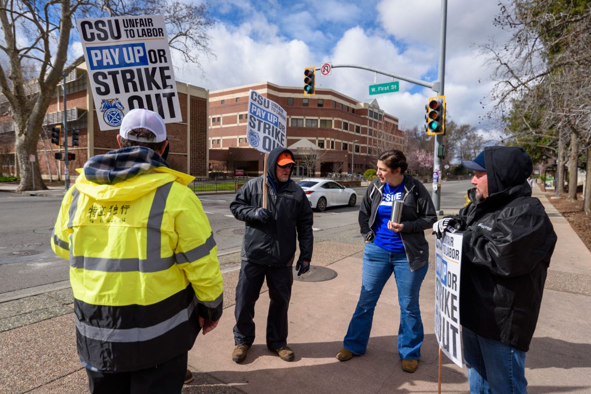 A member of the California State University Employee Union speaks with striking workers. Photo taken by Dash Ferrero on Sept. 18, 2026.