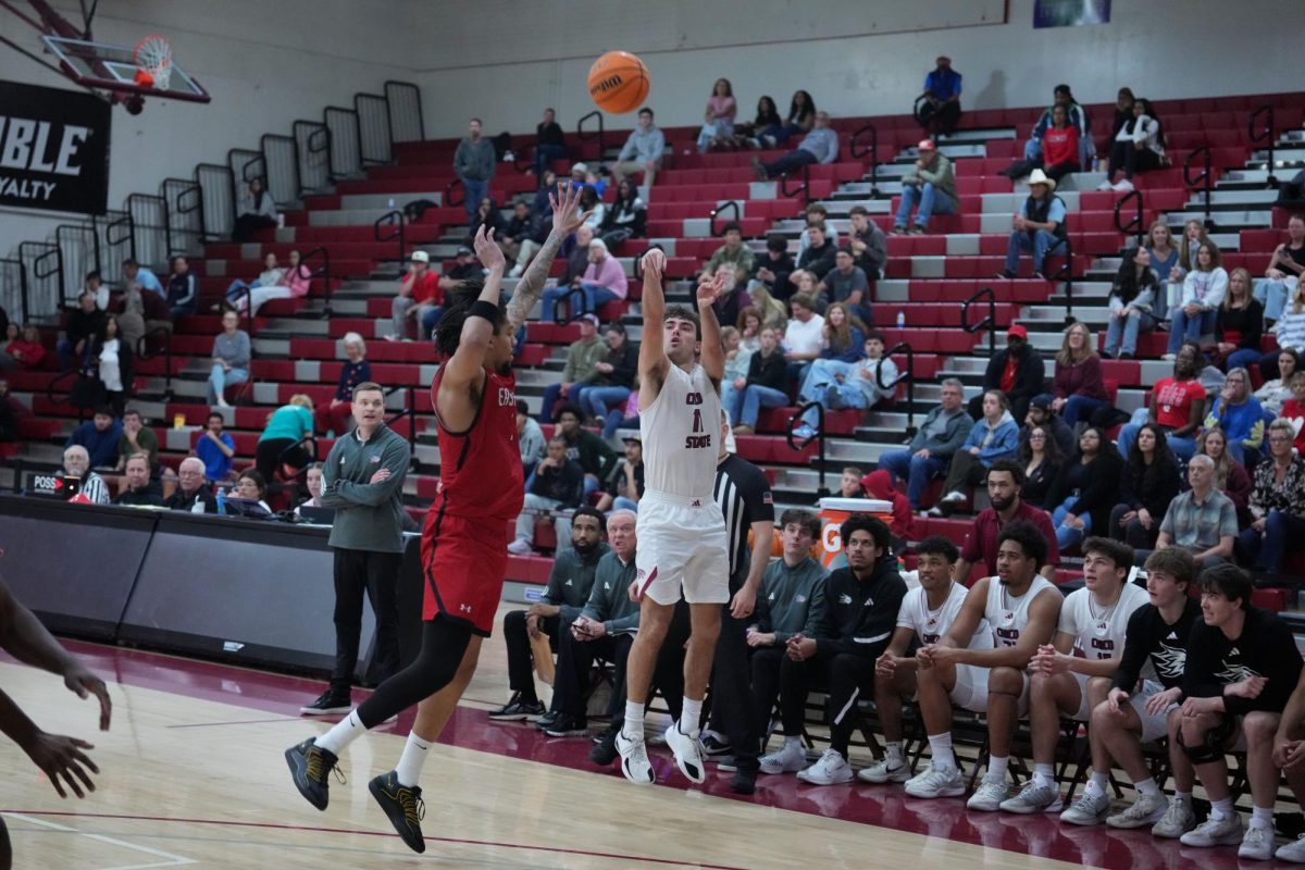 Max Walters taking a three-point attempt for the Wildcats, contested by a Cal State Eastbay defender. Photo taken by Cody Rowan on Feb. 14.