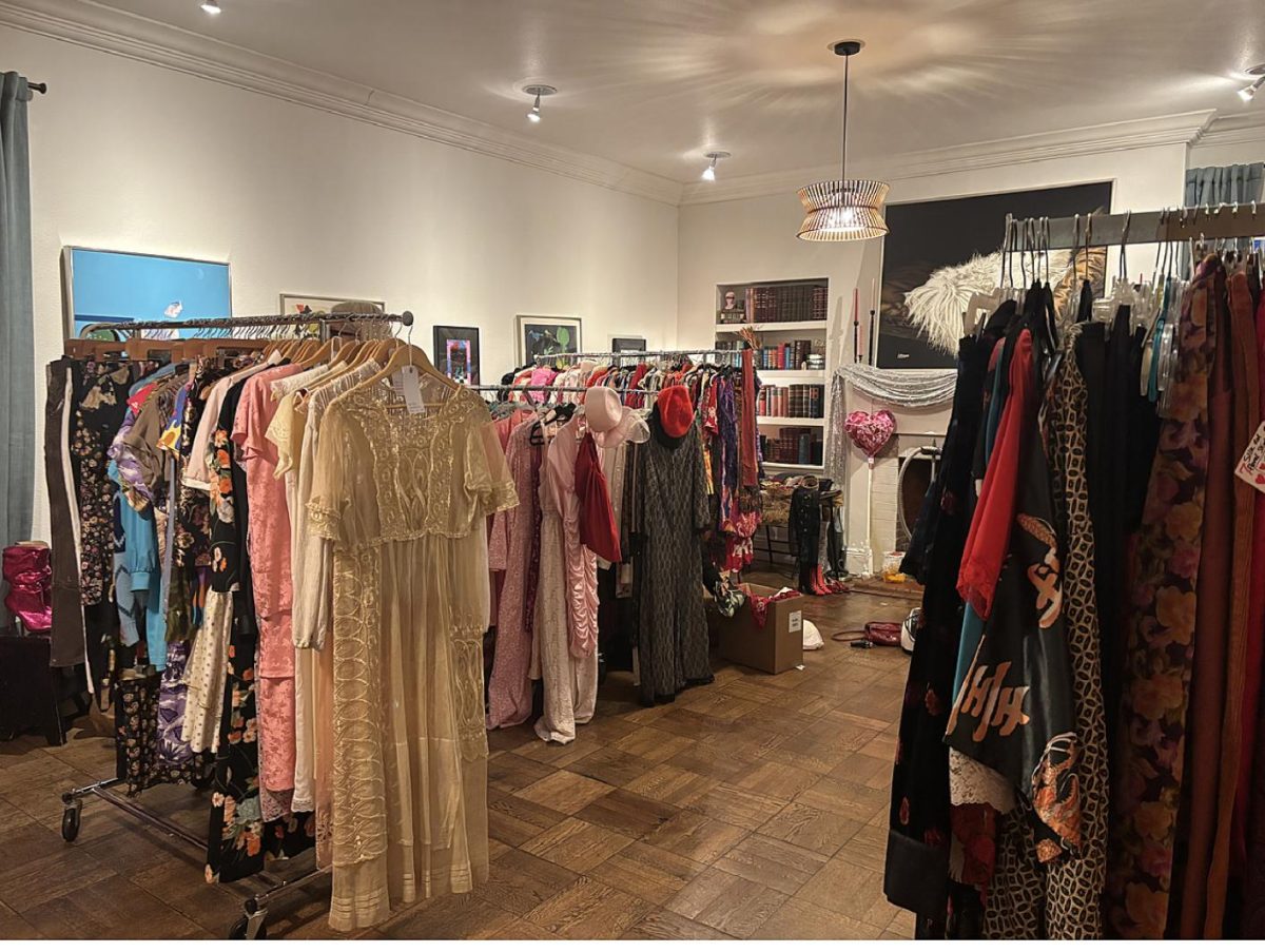 Vintage clothing racks are set up in the living room of Enloe Mansion before the Galentine’s Sip and Shop Market. Photo taken by Sydney Davis on Feb. 13, 2026