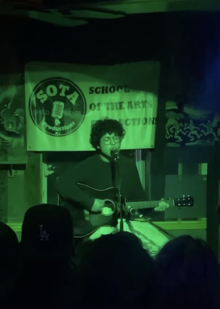 Giovanni Alvarez soothing the crowd with their guitar at Madison Bear. Photo taken by Makalya Anaya, October 2025