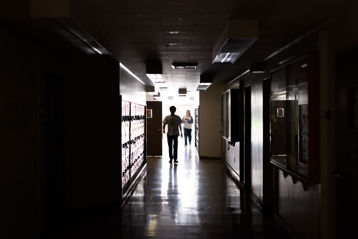 Students walk through a darkened Ayres Hall during a regional power outage on Monday, Mar. 9, 2026 in Chico, Calif. 
(Dash Ferrero/The Orion)
