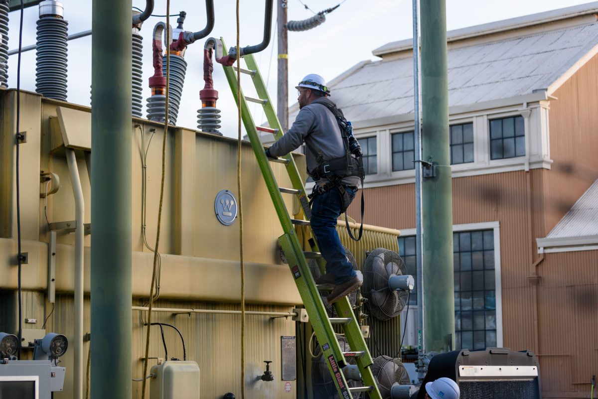 A PG&E worker climbs a transformer to take photos of damage to one of its bushings at the W 2nd & Orange St. substation following an outage that caused campus and much of the surrounding area to lose power on Monday, Mar. 9, 2026 in Chico, Calif.  PG&E workers who declined to give their names stated the damage was likely caused by a thrown object.
(Dash Ferrero/The Orion)