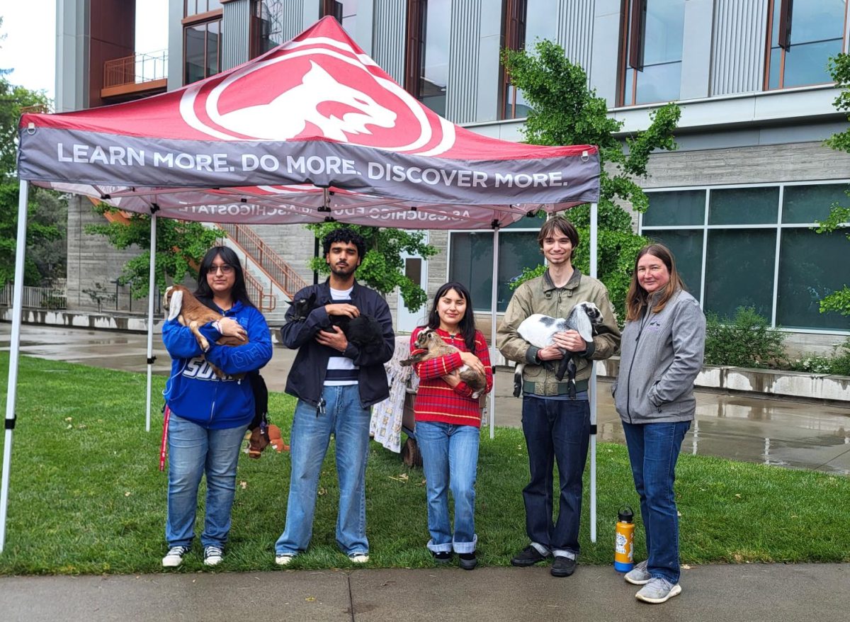 Students, from left the right, Sam Corarrubias (sophomore), Ringo Casmajor (junior) Paulina Rihanna (junior), and Eric Rodriguez (junior) pose with animals from Two by Two Ranch during an Earth Day event, joined by owner Tina Cardin, whose petting zoo business brought hands-on agricultural education and community engagement to attendees. Photo taken by Merri Shiger, April 22 2026.