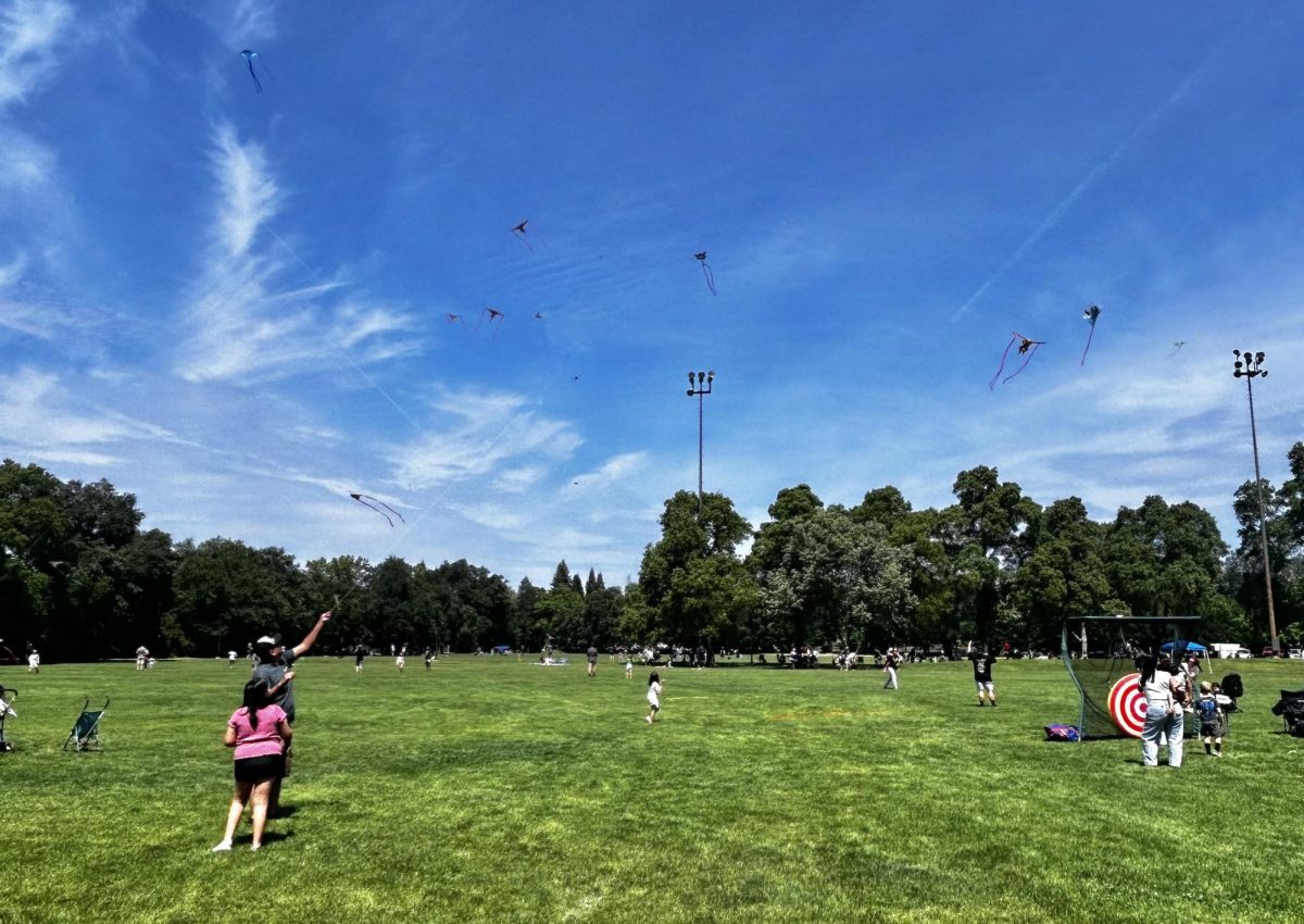 Families flying their kites for Kite Day 2026. Photo taken by Bria Martinez on April 19, 2026.
