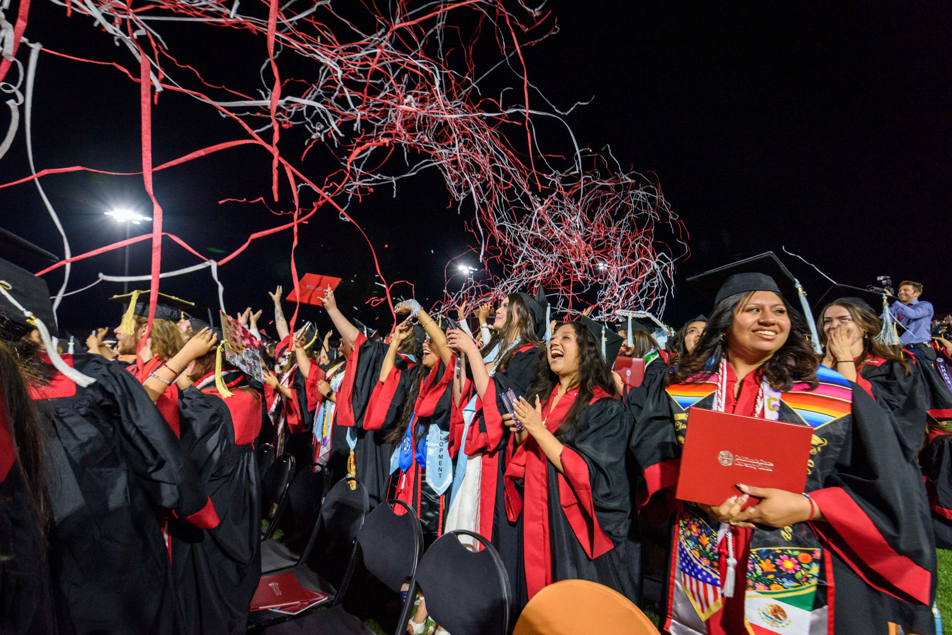 Students celebrate as streamers are shot over the crowd at the conclusion of the evening BSS commencement ceremony.
Photo taken by Dash Ferrero on May 16, 2026.