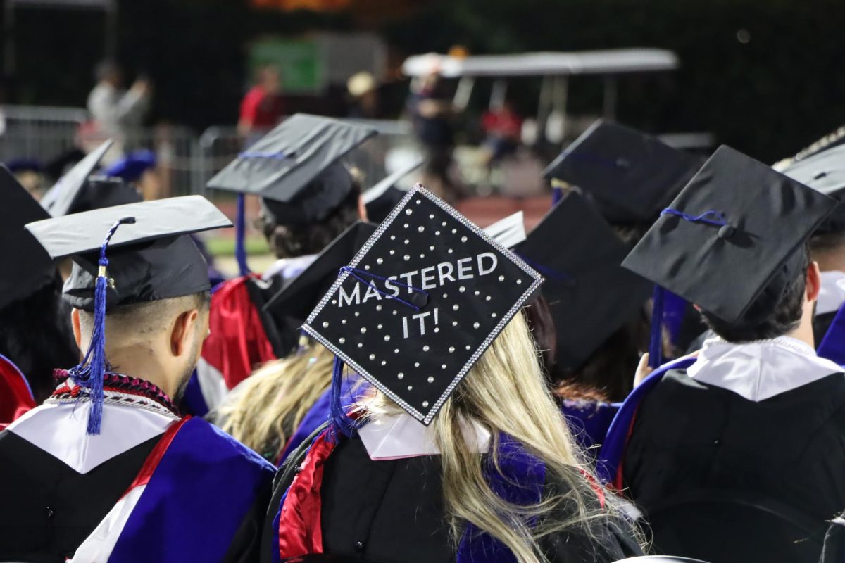 Another graduation cap decorated among the many. This one referencing a play-on-words as this graduate is receiving her Master's. Photo taken by Elizabeth Perez, May 13, 2026. 